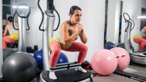 person-squatting-on-vibration-plate.jpg